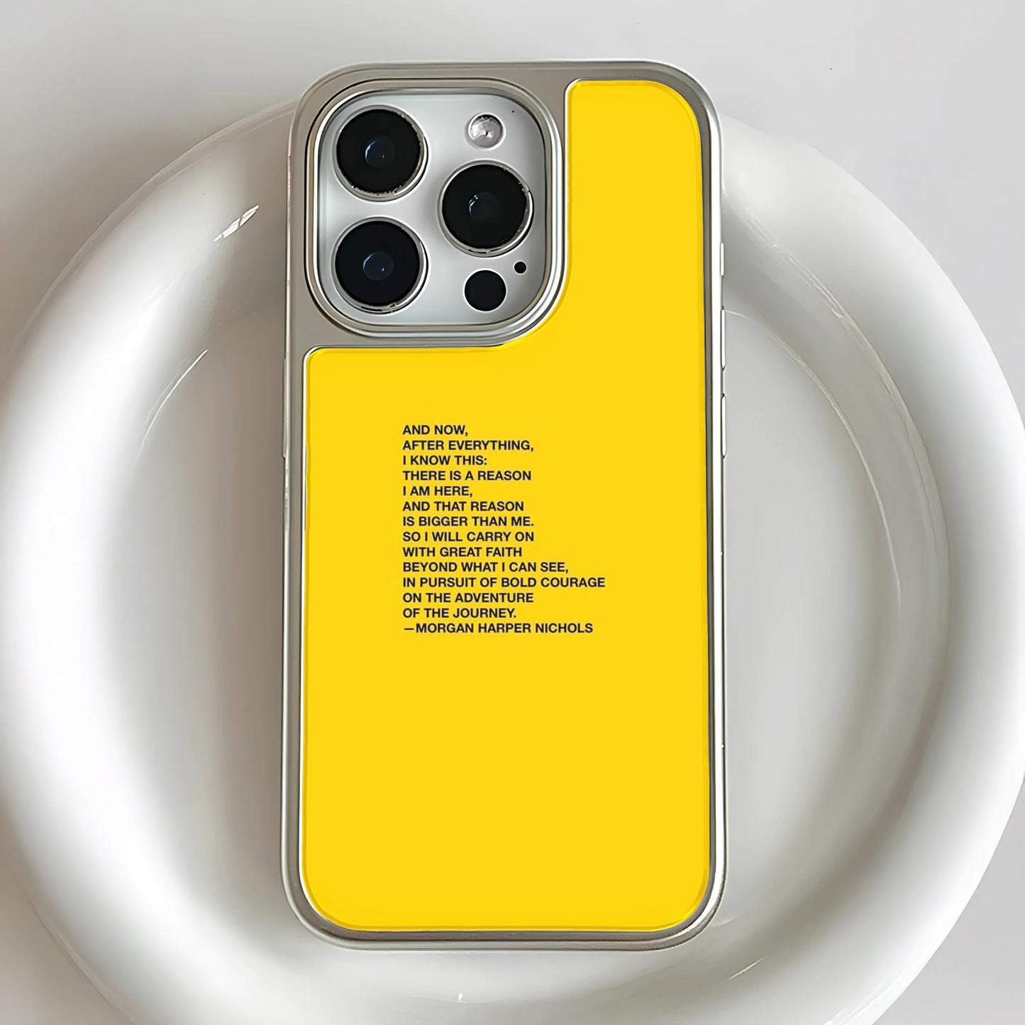 Bright yellow smartphone case featuring black typography with the "Reason is Bigger Than Me" poem by Morgan Harper Nichols.
