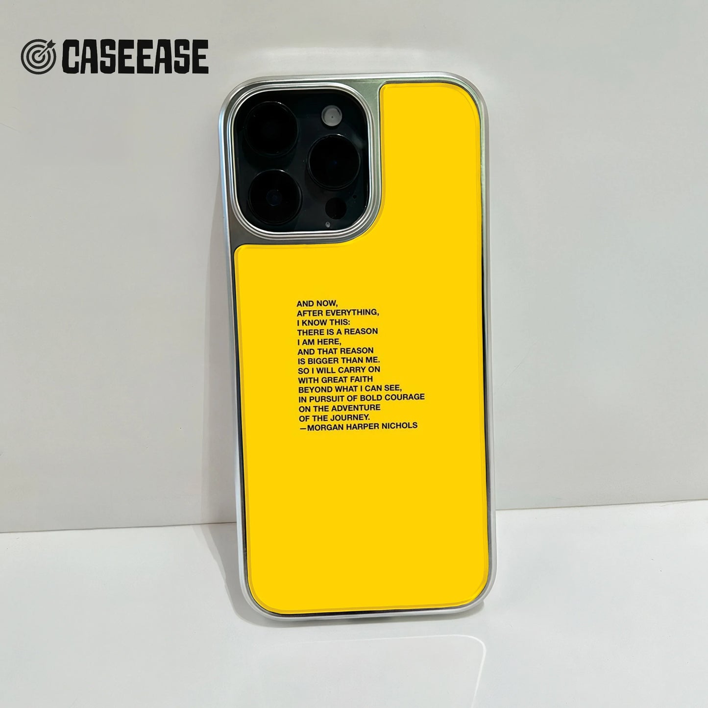 Bright yellow smartphone case featuring black typography with the "Reason is Bigger Than Me" poem by Morgan Harper Nichols.