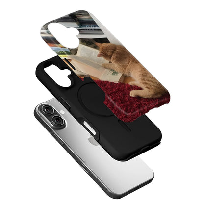 Black phone case with cat reading book print shown in angled exploded product view