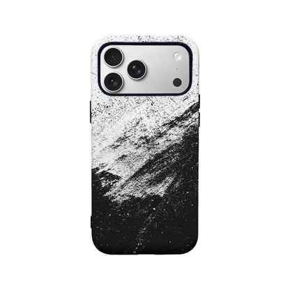 Black and white splatter plastic phone case shown from rear on smartphone