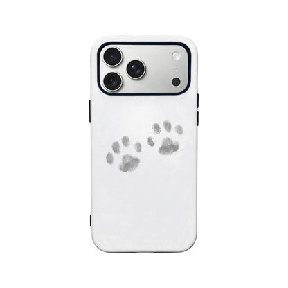 White smartphone case with gray paw prints, rear view showing camera cutout
